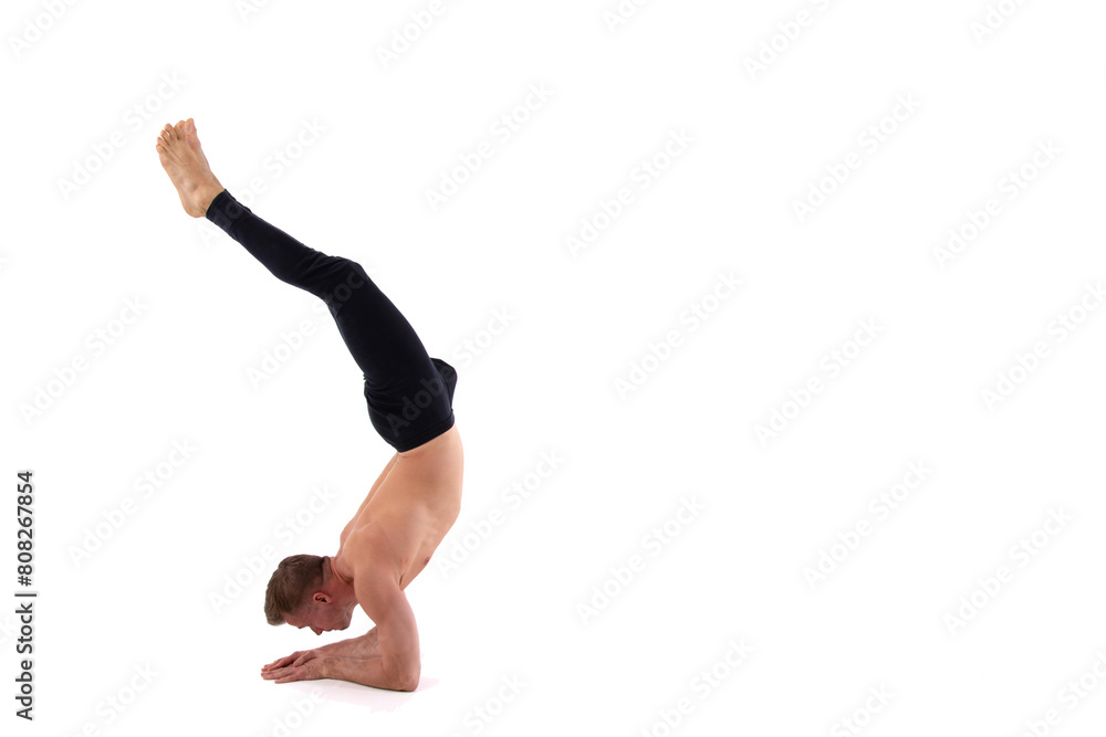 Fitness and meditation. Healthy lifestyle. Young attractive man doing yoga on a white background. Fitness and meditation. Healthy lifestyle. Young attractive man doing yoga on a white background.