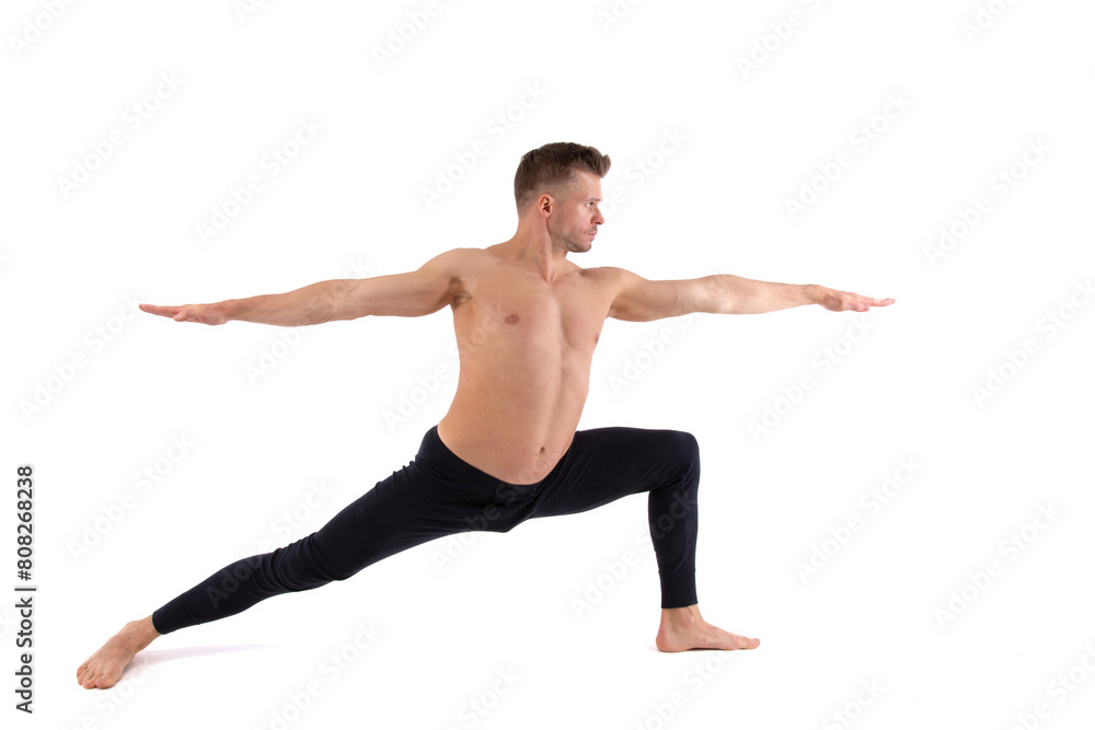 Fitness and meditation. Healthy lifestyle. Young attractive man doing yoga on a white background.