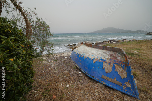 boats on Krioneri beach in Zakynthos on a cloudy day