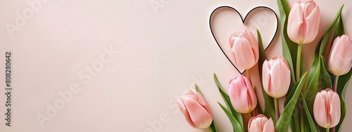 heart shaped cutout with pink tulips on a corner of light pink background #808280642
