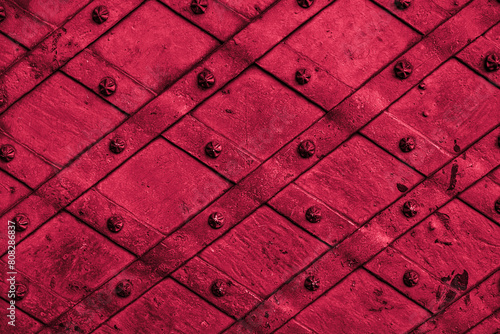 Closeup of red forged metal door