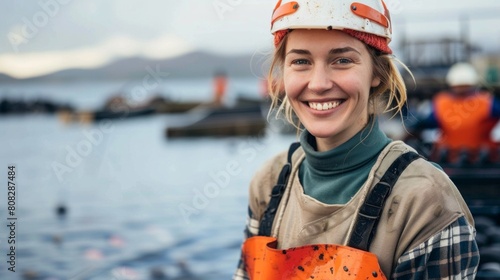 Portrait of female owner on sturgeon farm fish photo