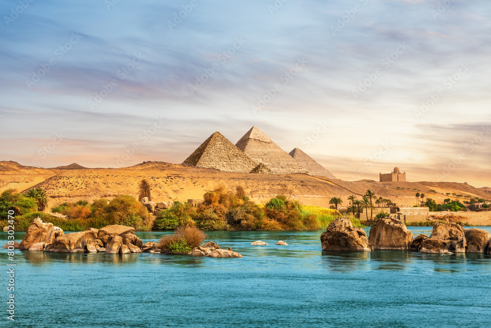 The Nile river and ancient rocks in the Aswan desert by the pyramids, Egypt