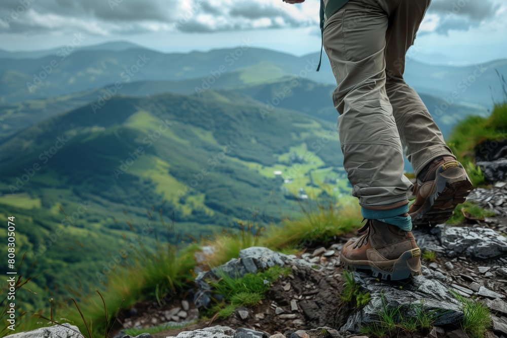A traveller walks through the mountainous terrain A traveller walks through the mountainous terrain