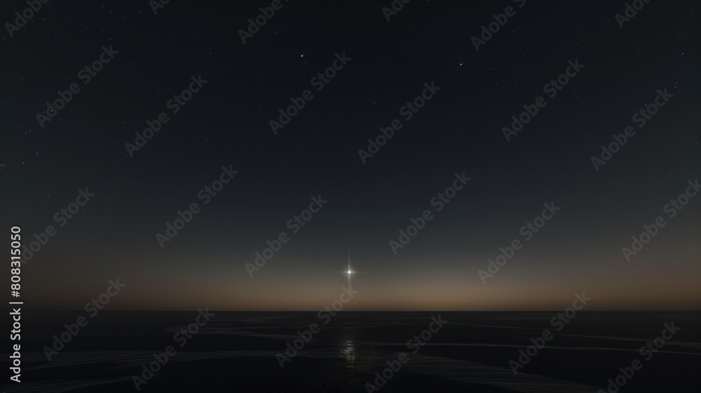 distant view of the vast sea surface and sky with a bright Sirius star shining in the distance, calm waters in low tide with gleaming light reflections
