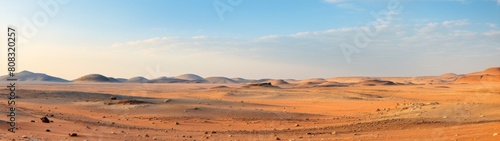 Vast desert landscape with rolling sand dunes and mountains