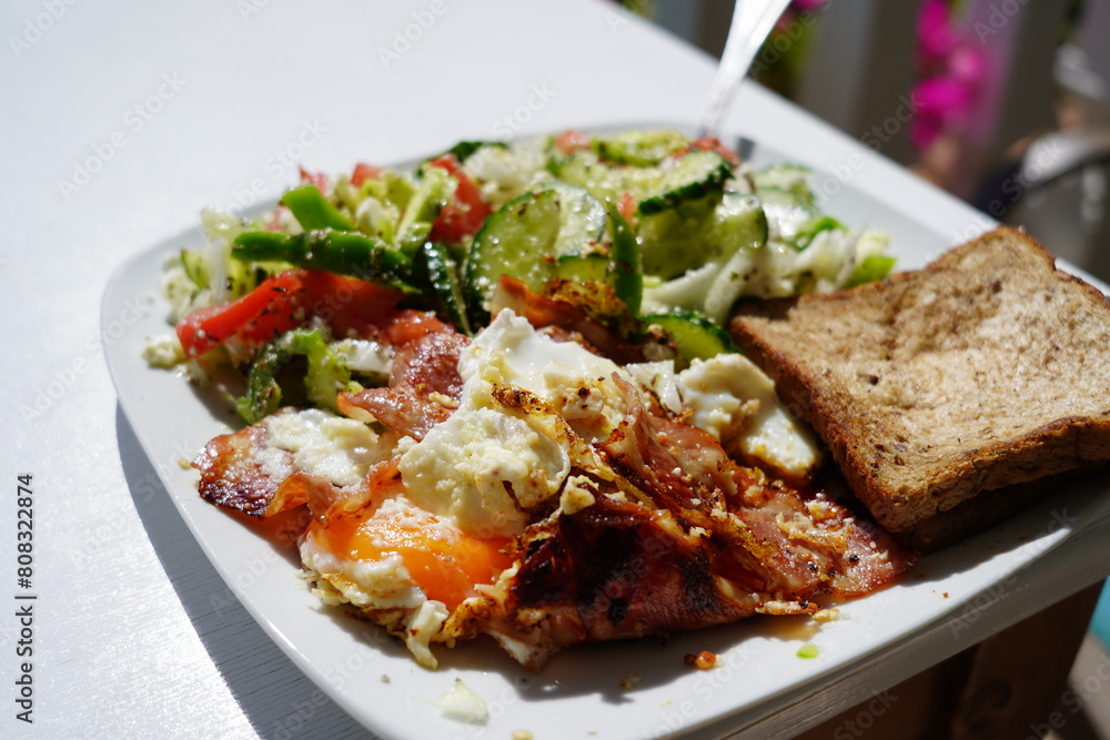 healthy and balanced meal with toast , scrambled eggs and vegetables healthy and balanced meal with toast , scrambled eggs and vegetables