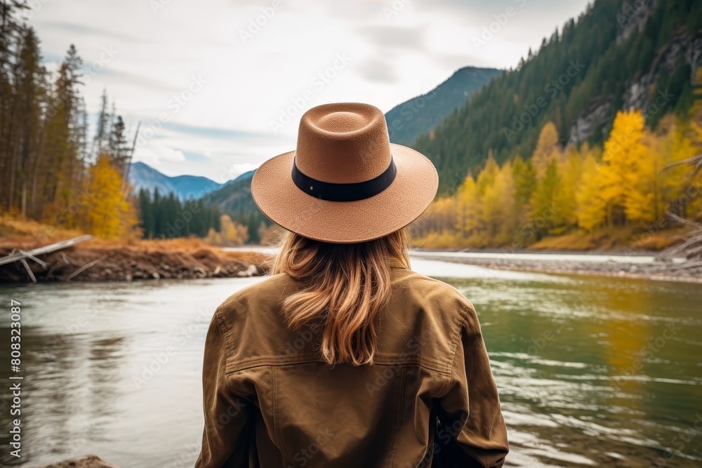 person in hat enjoying scenic mountain landscape person in hat enjoying scenic mountain landscape
