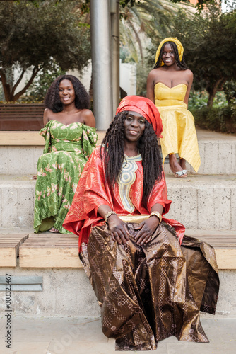 Group of women of different ages with typical African costumes. Concept: tradition religion