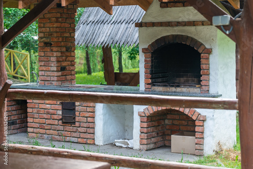 Brick outdoor oven in a village on a summer day