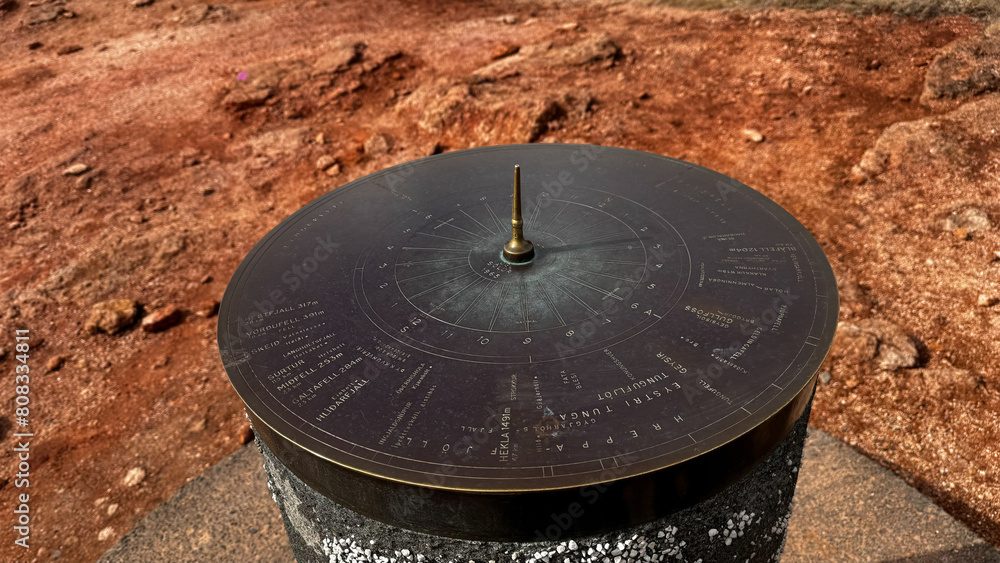 Sundial in Thingvellir National Park, Iceland. Round, iron sundial, spring in the geyser zone.