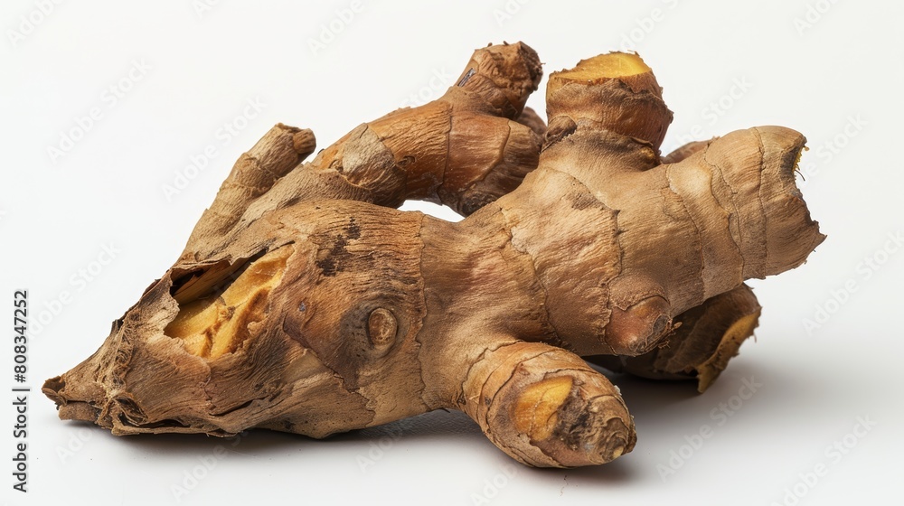 Close-up of a ginger root piece, emphasizing its knobby texture and earthy color tones, isolated against a stark white backdrop