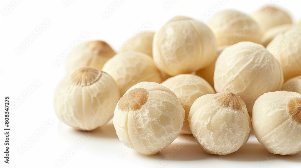 Close-up of a group of cashew nuts, emphasizing their textured, wrinkled skin and rich color, isolated on a stark white background Close-up of a group of cashew nuts, emphasizing their textured, wrinkled skin and rich color, isolated on a stark white background