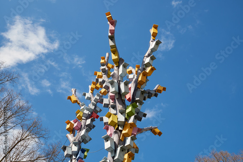 Bird houses on a tree against the sky. Wooden birdhouses, nesting boxes in Esplanade park, Riga, Latvia.