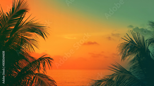 Vibrant tropical sunset creating beautiful silhouettes of palm trees against an orange sky