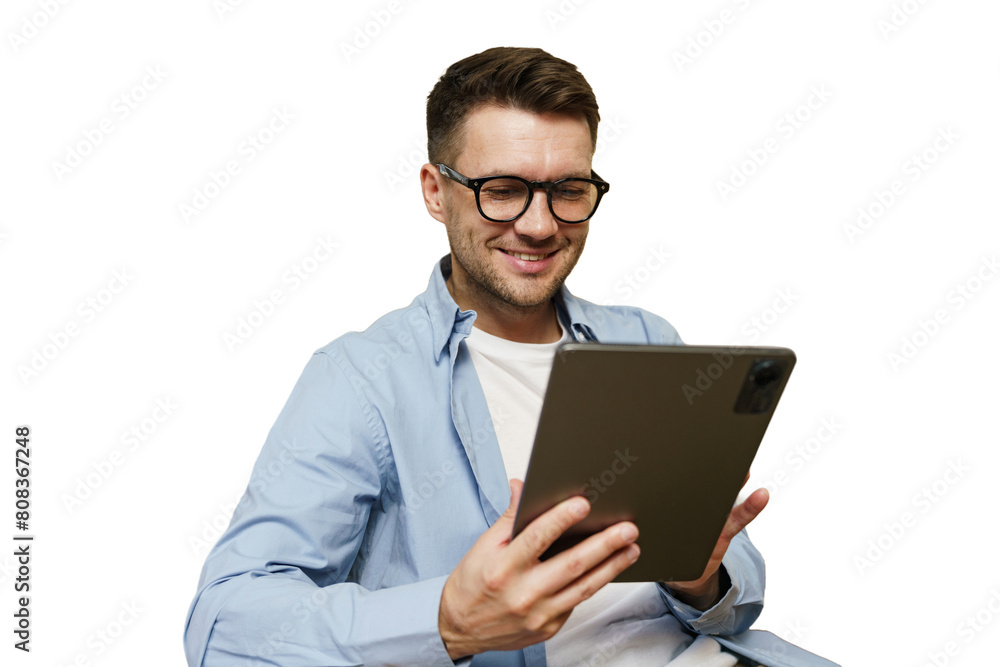 A man manager with glasses uses a tablet, online work in an application, cut isolated