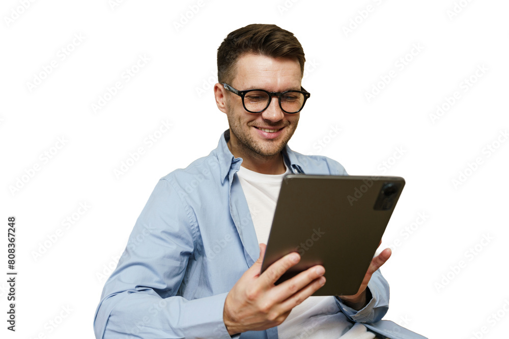 A man manager with glasses uses a tablet, online work in an application, cut isolated A man manager with glasses uses a tablet, online work in an application, cut isolated