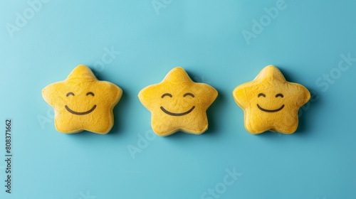 Smiling yellow star cookies on bright blue background