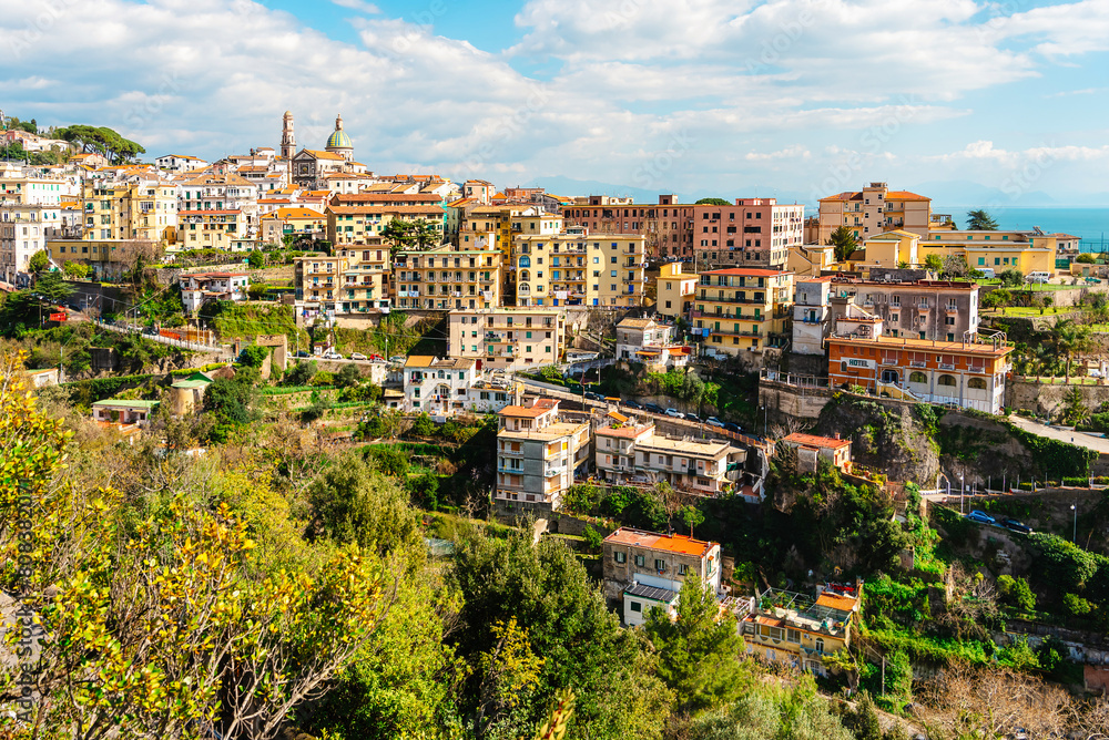 Fototapeta premium Panoramic view of the city of Vietri sul Mare. Residential buildings and a church. The Amalfi coast of Italy