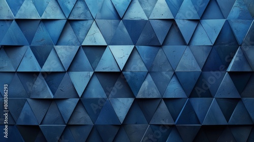 Abstract geometric pattern of blue triangular tiles with a textured surface photo