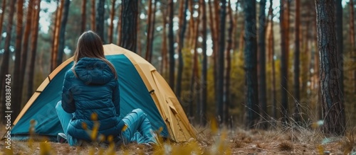Portrait of a woman camping alone in the forest