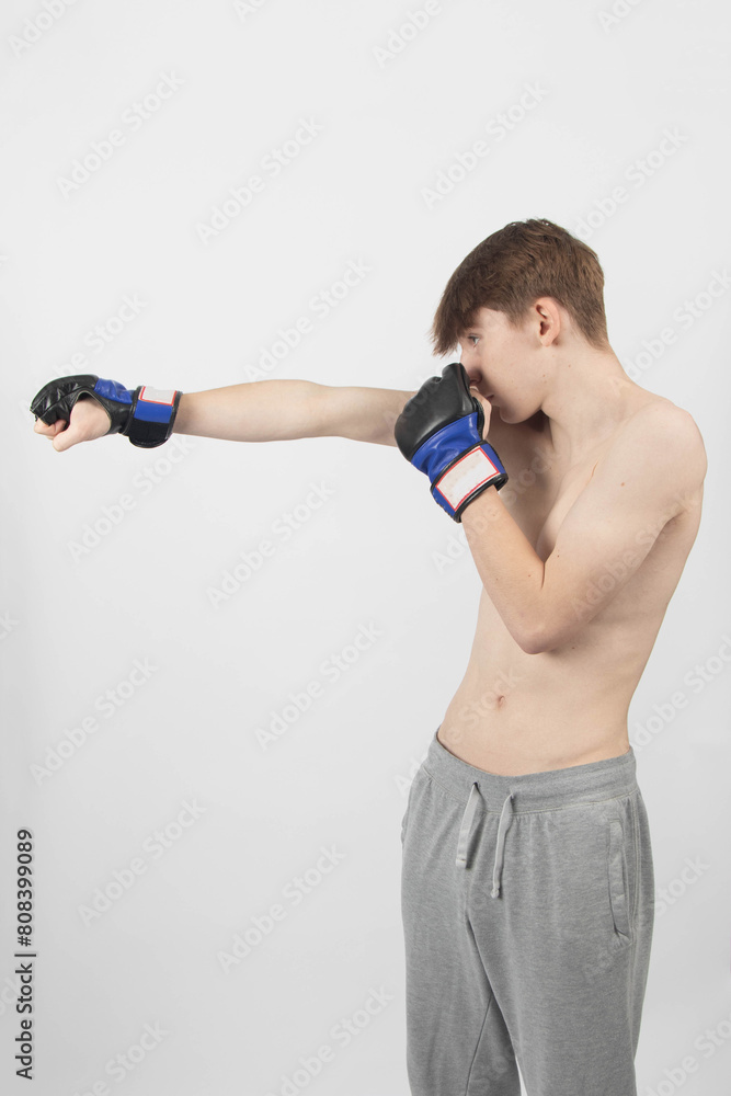 A Shirtless Teenage Boxer Boy