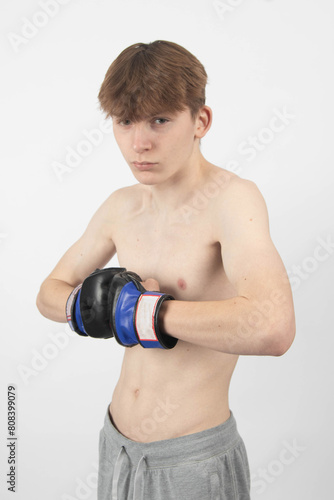 A Shirtless Teenage Boxer Boy