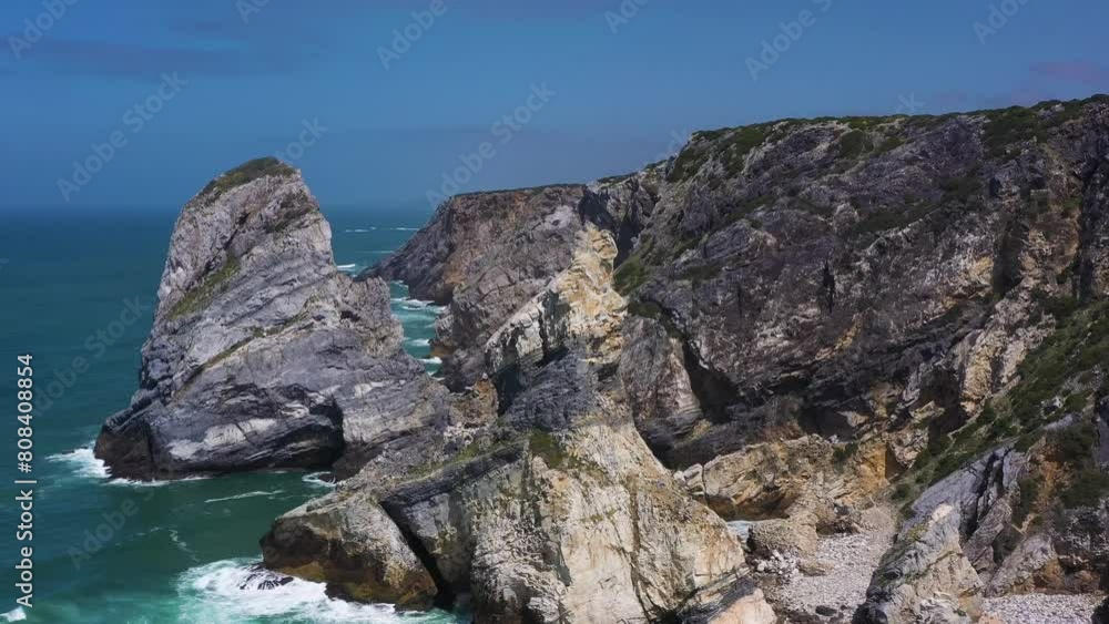 Ursa Beach, Two Sea Stacks, Cliffs and Atlantic Ocean Waves on Sunny Day. Portugal. Aerial View. Orbiting, Tilt Down Ursa Beach, Two Sea Stacks, Cliffs and Atlantic Ocean Waves on Sunny Day. Portugal. Aerial View. Orbiting, Tilt Down