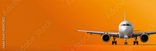 Travel insurance banner. Airplane isolated on orange background for peace of mind. photo