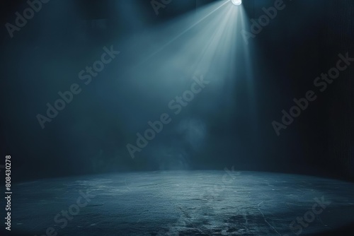 Spotlight effect on a dark stage, evoking a sense of focus or illumination photo