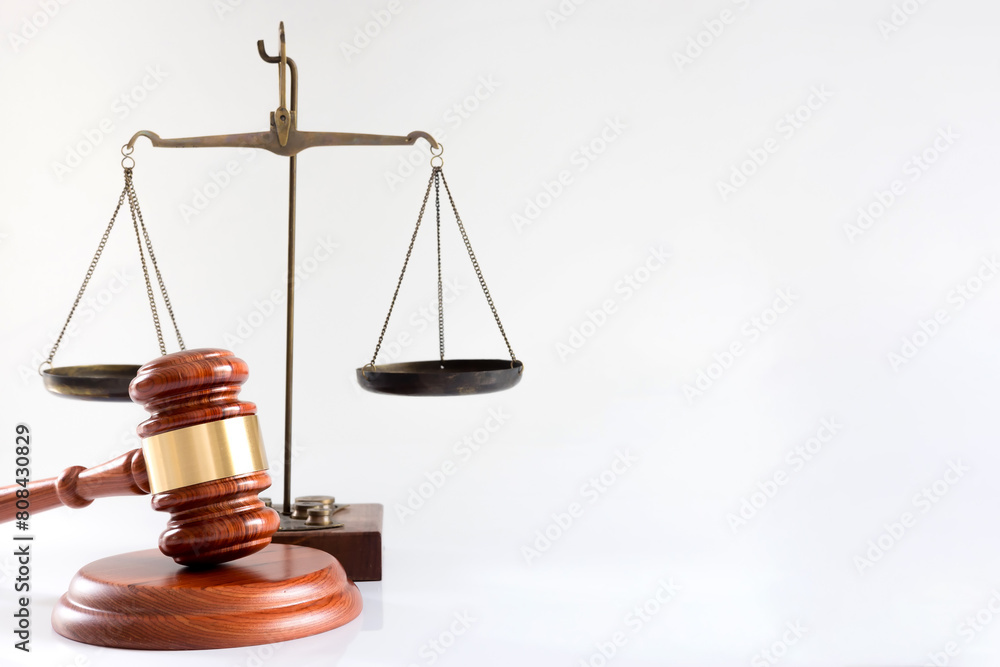 Judge's gavel hammer and scales of justice isolated on a white background Judge's gavel hammer and scales of justice isolated on a white background