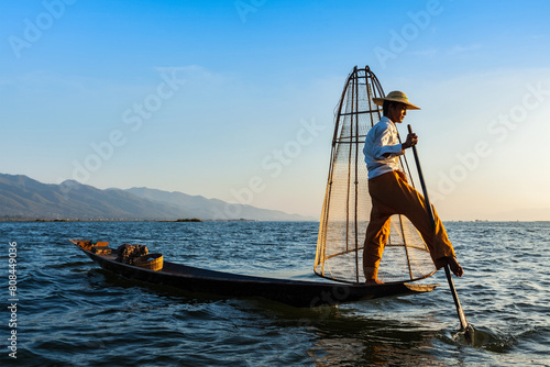 Myanmar travel attraction landmark - Traditional Burmese fisherman at Inle lake, Myanmar famous for their distinctive one legged rowing style © Dmitry Rukhlenko