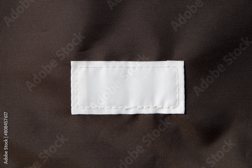 Close up of blank white color clothing label on canvas bag