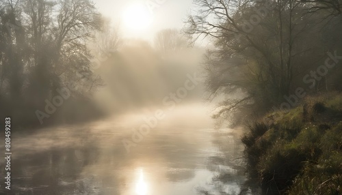 A misty morning on the river with the sun breakin