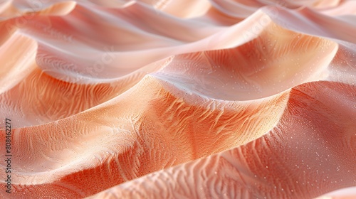 Close-up view of fine sand textures in soft peach shades, highlighting the delicate patterns and ripples formed by a gentle breeze across the dune surface.