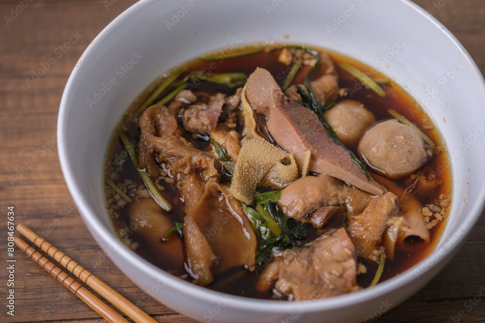 Close up of a bowl of Thai Braised beef Noodle Soup. Close up of a bowl of Thai Braised beef Noodle Soup.