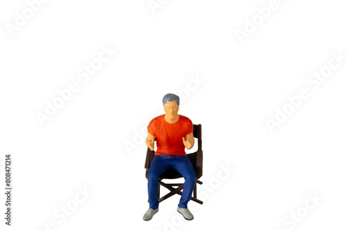A Young man seated on a chair isolated on white background with clipping path