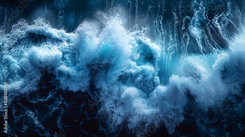 Dramatic aerial view of deep blue crashing ocean waves photo