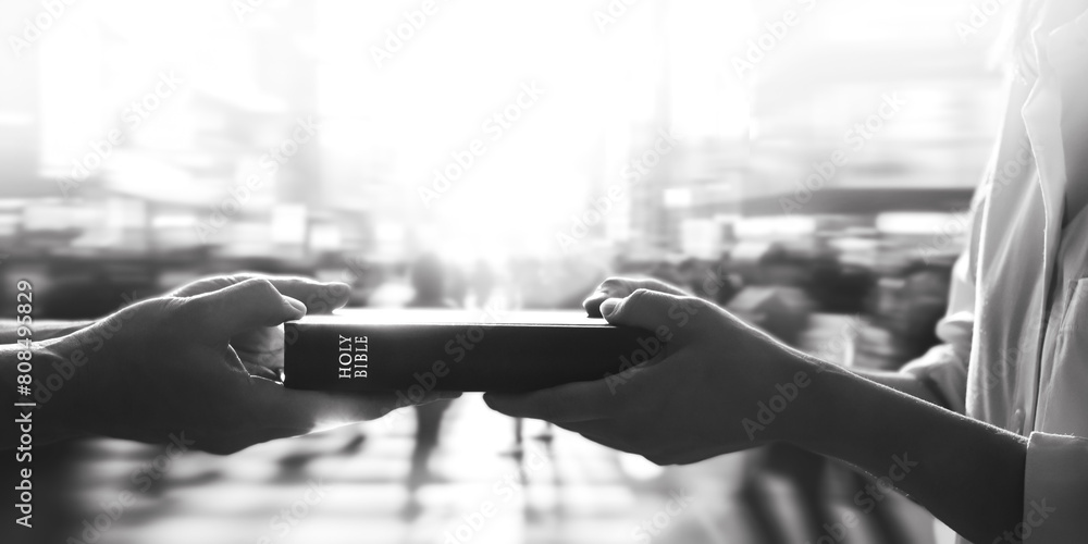 Φωτογραφία Christians spreading God's love and gospel by giving Bible books on city streets