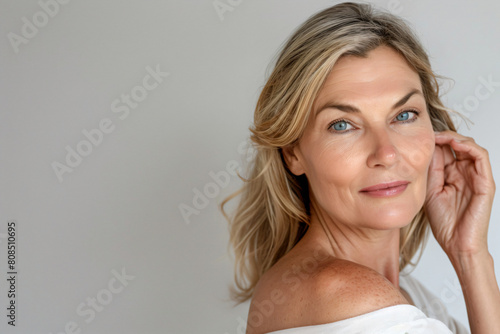 a woman with freckles on her shoulders and shoulders