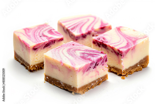 a group of four pieces of cheesecake with pink swirl