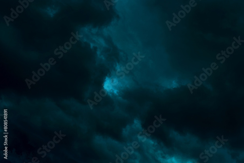 Dramatic stormy sky background. Dark green fluffy cloudy sky. Halloween cloudscape background concept.