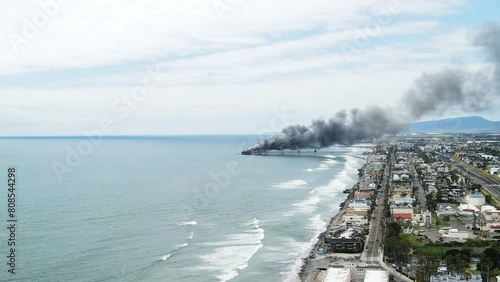 pier on fire with black smoke photo