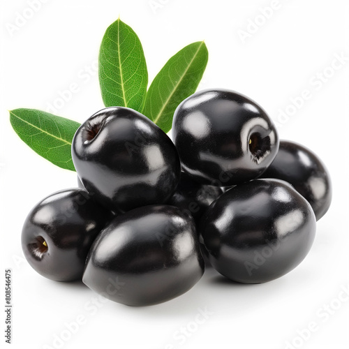 a close up of a pile of black berries with leaves