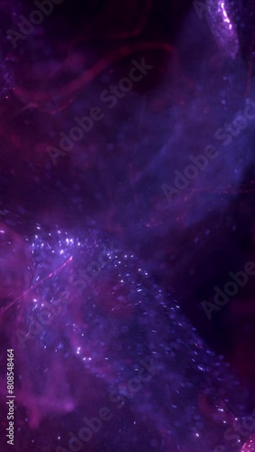 Elegant purple pink abstract particle swirl background loop. Decorative vertical surreal luxury 3D animation backdrop. Glowing light streaks and vibrant sparks showcase backplate.