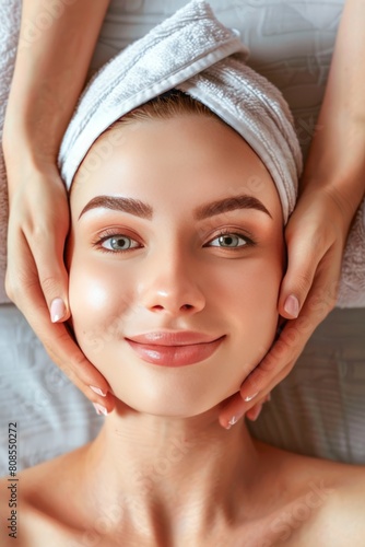 Serene Woman Enjoying a Relaxing Facial Massage at a Wellness Spa