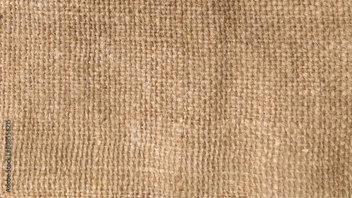 Close-up of fabric woven from burlap. Color photo of the texture of a brown burlap potato sack.