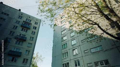 Travel to left in front of old vintage ex soviet ussr flat apartment block buildings photo