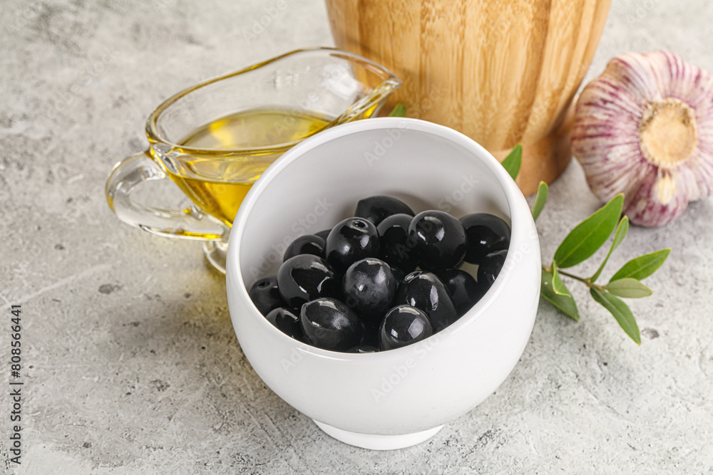 Black olives with oil and branch Black olives with oil and branch