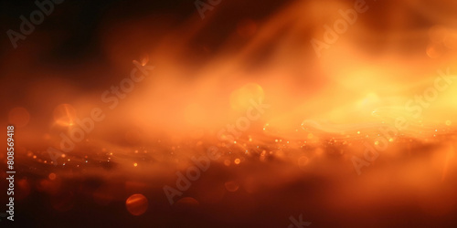A blurred golden light with a dark background, close up of fire in the night 